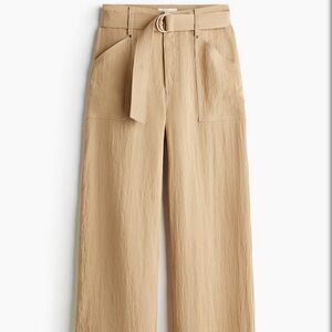 Stylish tan high-waisted pants.Size 36/04.
